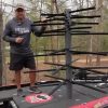 Man standing next to Predator Prey Combo Tree