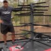 Man standing next to Predator Prey Combo Tree
